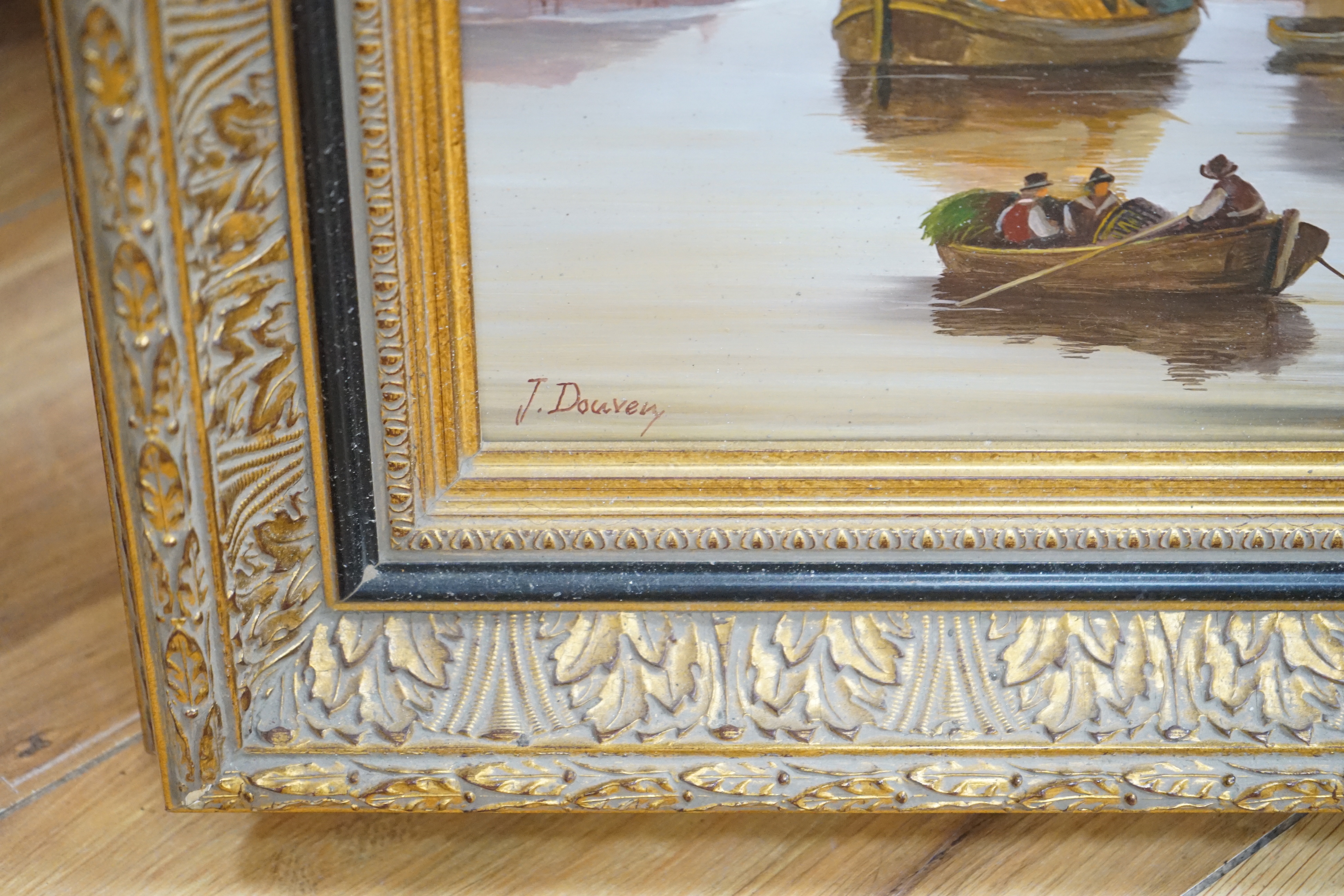 Jacques Douven (1908-2002) oil on board, Town scene with river and boats, signed, 38 x 48cm, ornate gilt framed